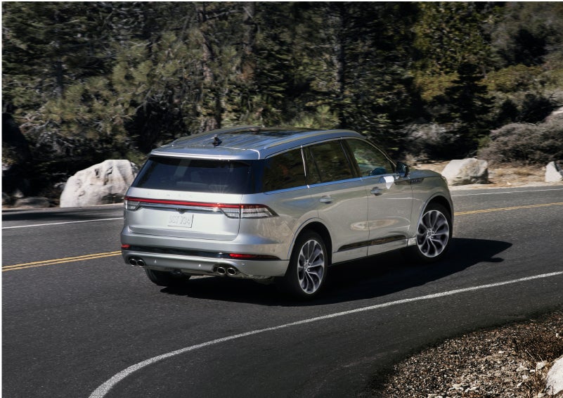 A Lincoln Aviator® is being driven on a winding road | Brinson Lincoln of Corsicana in Corsicana TX