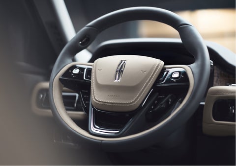 The intuitively placed controls of the steering wheel on a 2023 Lincoln Aviator® SUV | Brinson Lincoln of Corsicana in Corsicana TX