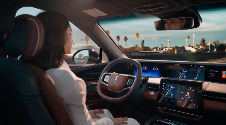 A person is shown driving hands-free on the highway with available Lincoln BlueCruise technology. | Brinson Lincoln of Corsicana in Corsicana TX