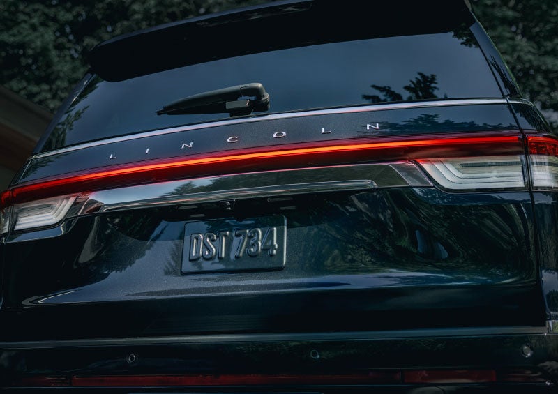 The wraparound rear lights of a Lincoln Navigator® SUV are shown.